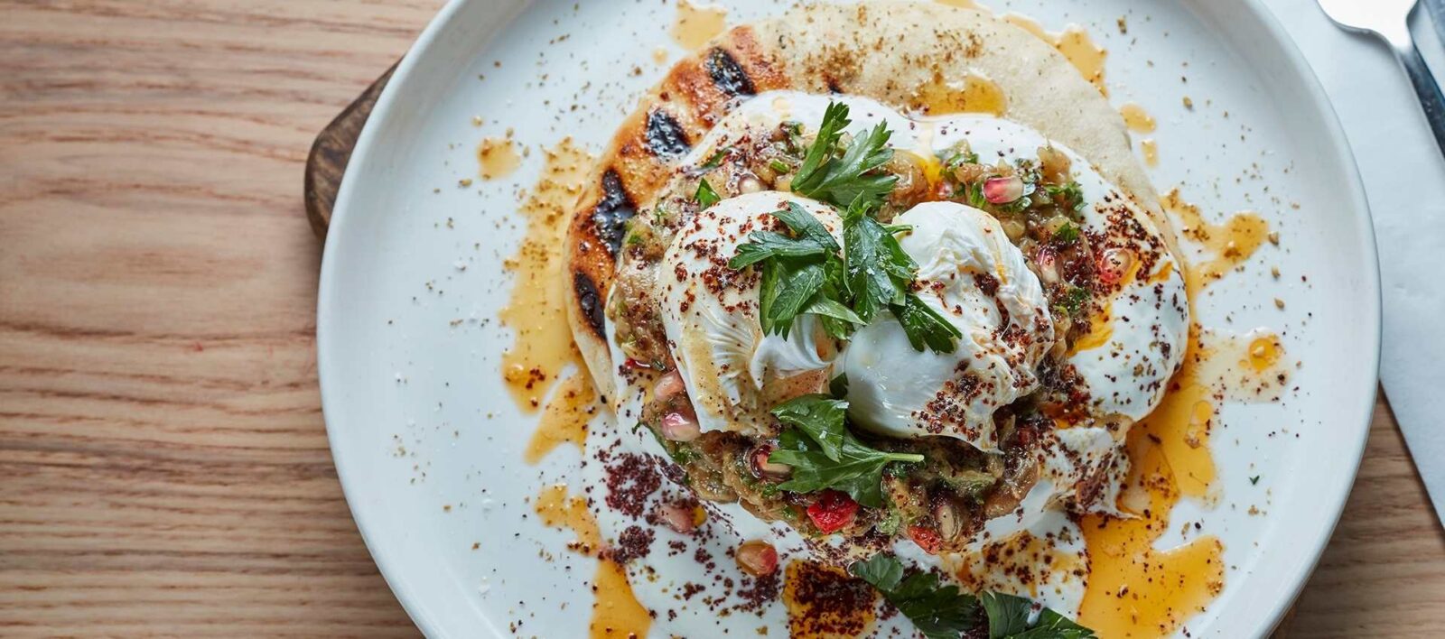 `Burnt aubergine with poached eggs and labneh weekend brunch Amber Aldgate East`